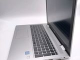 a laptop that is sitting on a white table