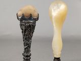 two small vases with eggs in them sitting next to each other