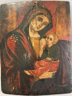 une peinture ancienne représentant une femme tenant un bébé dans ses bras