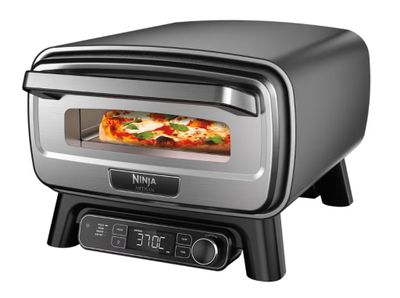 une image représentant un petit four avec une pizza à l'intérieur