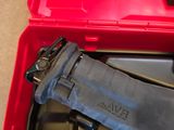 a tool in a red case with a black handle