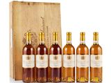 six bottles of wine in a wooden box with a wooden box