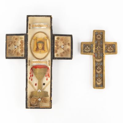 two crosses and a box with a picture of jesus on it