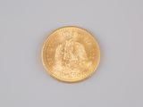 a gold coin with a picture of an angel on it