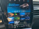 a close up of a car dashboard with a tablet on it