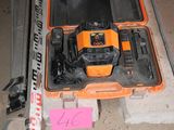 an orange and black electrical device on the wall