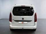 a picture of a white van parked in a showroom