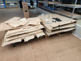 a pile of cardboard sitting on top of a pallet in a warehouse