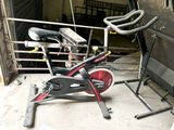 a bike that is sitting on the ground in front of a garage
