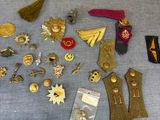 a lot of badges and pins on a table