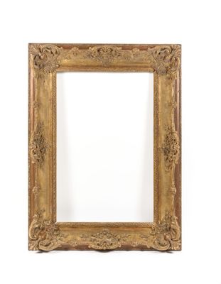 a gold frame with a white background and a white wall