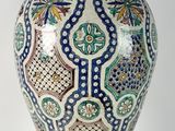 a large vase with a lid on a white background
