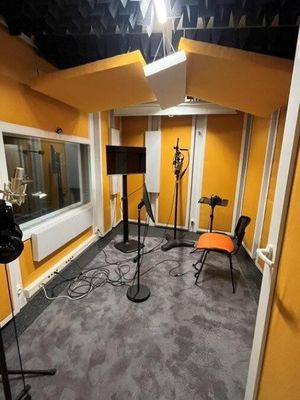 a room with two microphones and two chairs in it