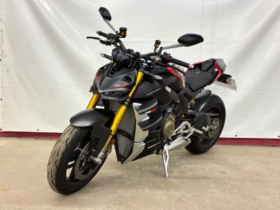 a picture of a black motorcycle parked in a garage