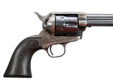 an old gun with a wooden handle on a white background