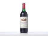 a bottle of red wine sitting on top of a table