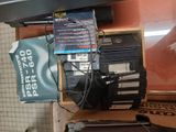 a lot of electronics on a shelf in a room