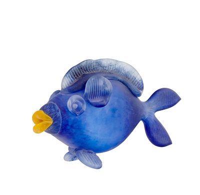 a blue fish that is sitting on a white surface