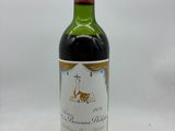 a bottle of wine that is sitting on a table