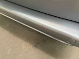 a close up of a car ' s bumper with a sticker on it