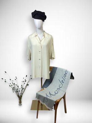 a mannequin with a shirt and a scarf on it
