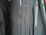 a couple of jackets hanging on a rack in a store