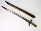 pair of antique swords on a white surface with a yellow handle