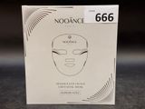 a box with a face mask on it sitting on a table