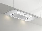 a white kitchen with a stainless steel range hood and lights