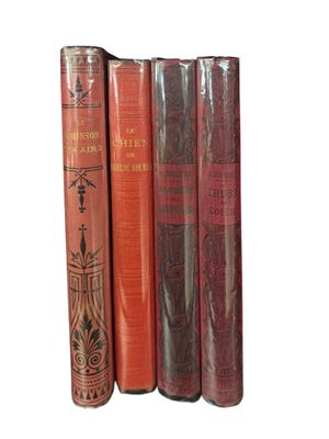books are lined up in a row on a white surface