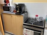 a small kitchen with a stove, microwave, and dishwasher