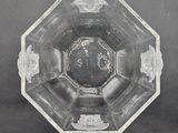 a clear glass bowl with a design on the inside of it