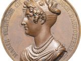 une image représentant une médaille de bronze sur laquelle figure le visage d'une femme