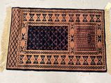 a close up of a rug on a floor with a white background