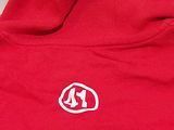 the back of a red sweatshirt with a white k logo on it