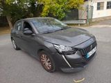 a grey car that is parked on the side of the road