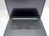 a laptop that is sitting on a white table