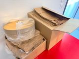 a stack of boxes sitting on top of a red table