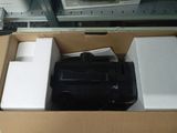 a black suitcase sitting in a box on the floor