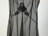 a black and white dress hanging on a hanger