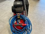 an image of a machine with a hose attached to it