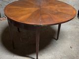 an image of a wooden table with a circular top