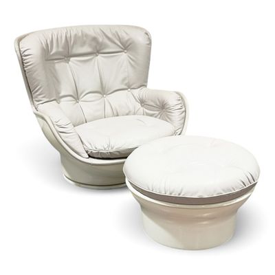 a white chair and ottoman sitting next to each other