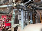 a picture of a machine that is working on a piece of metal