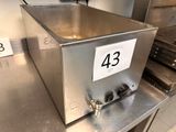 a metal box with a number on it sitting on a counter
