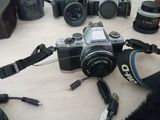 a camera that is sitting on a table next to other cameras