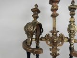 three candles that are sitting on a stand together