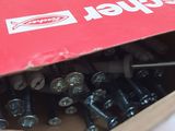a box of screws and nuts sitting on a table
