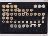 an image of a display case filled with lots of different types of buttons