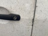 a close up of a door handle on a white car